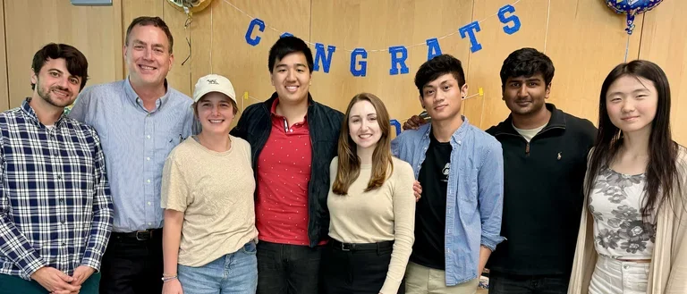 Bradley Lab posing for a group photo at Rebecca's defense