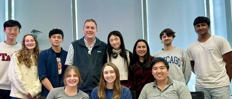 Bradley lab standing in front of birthday cake