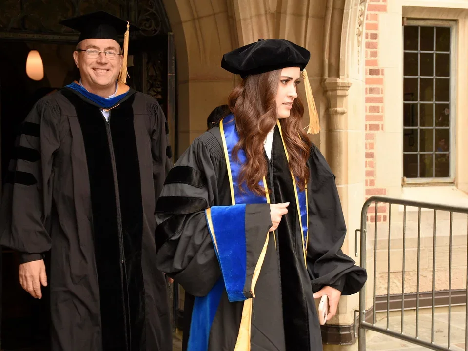 professor and student walking out of Kerkoff hall