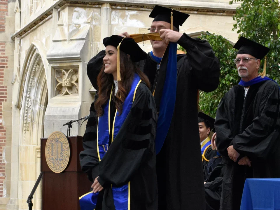 graduate student receiving PhD hood