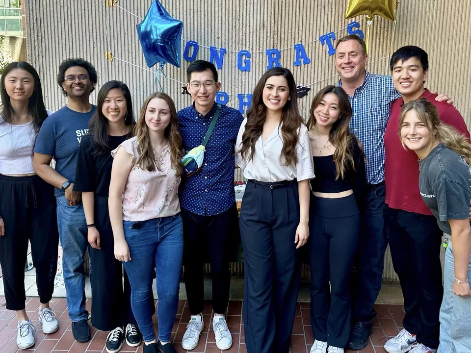 Group photo outside of Boyer Hall during a celebration. Congrats Amara on defending your Thesis!