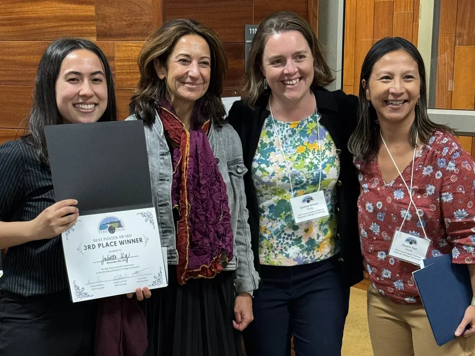 student celebrating her best poster award