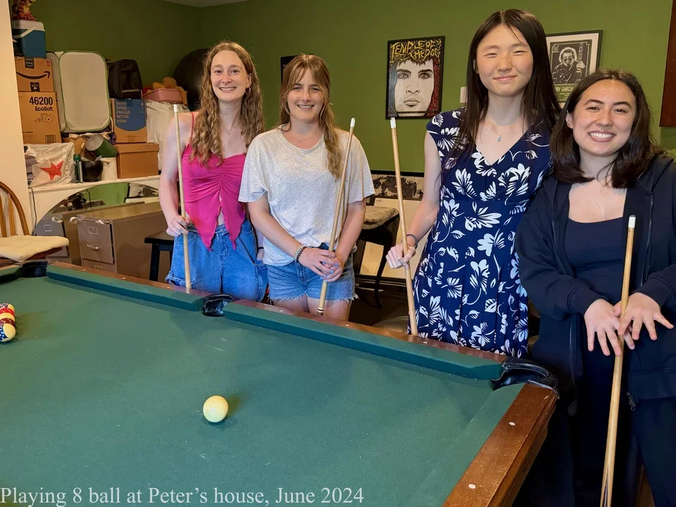 4 girls playing 8 ball