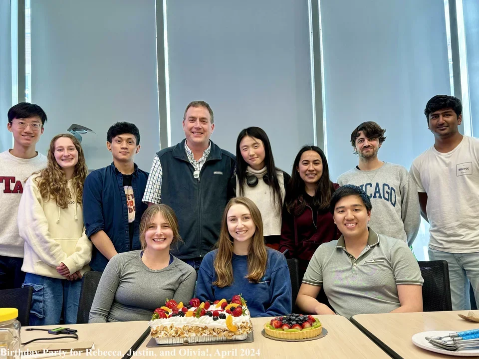 Bradley lab standing in front of birthday cake