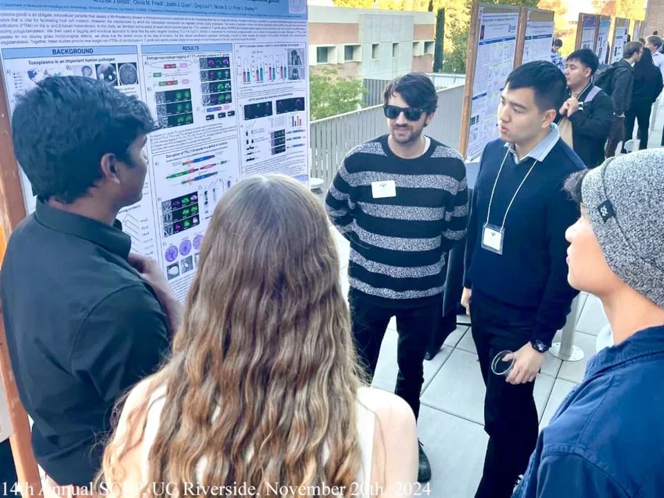 students presenting a poster at uc riverside