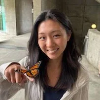Chloe Hu holding butterfly