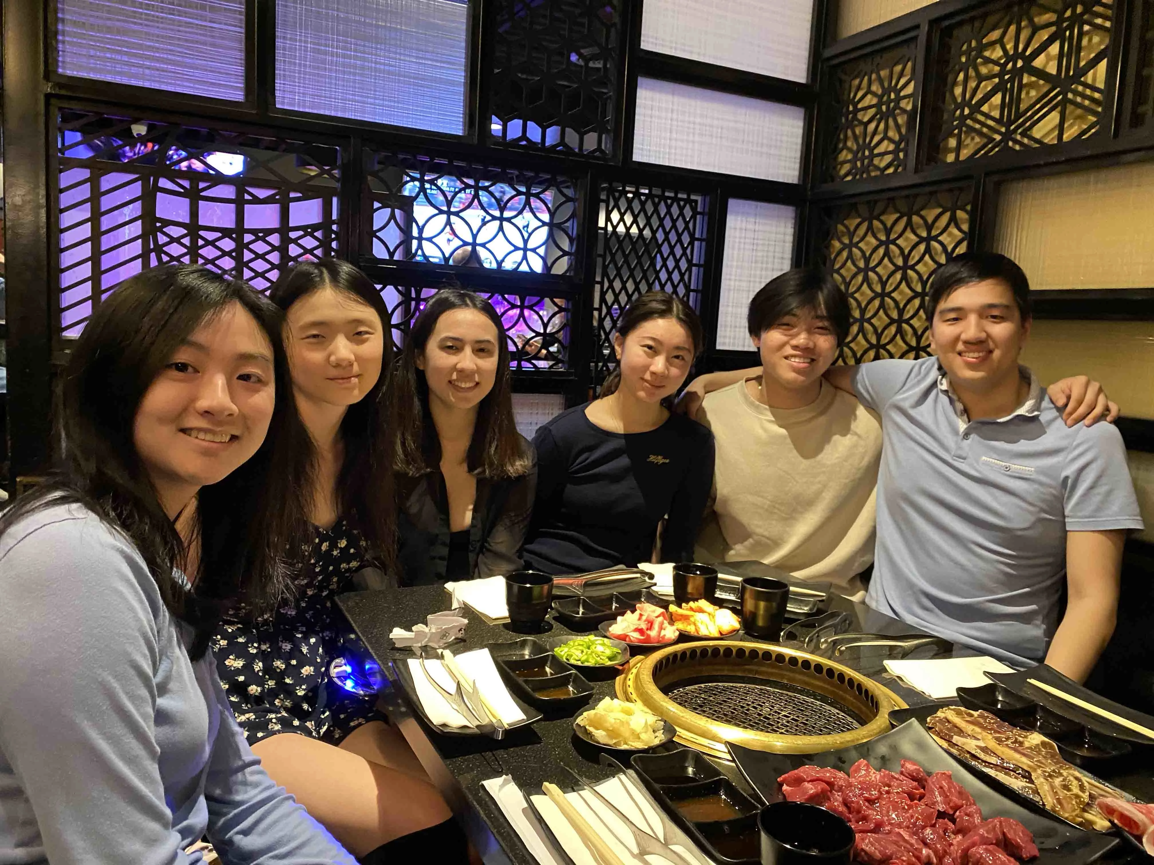 Six undergrad lab members are eating KBBQ together.
