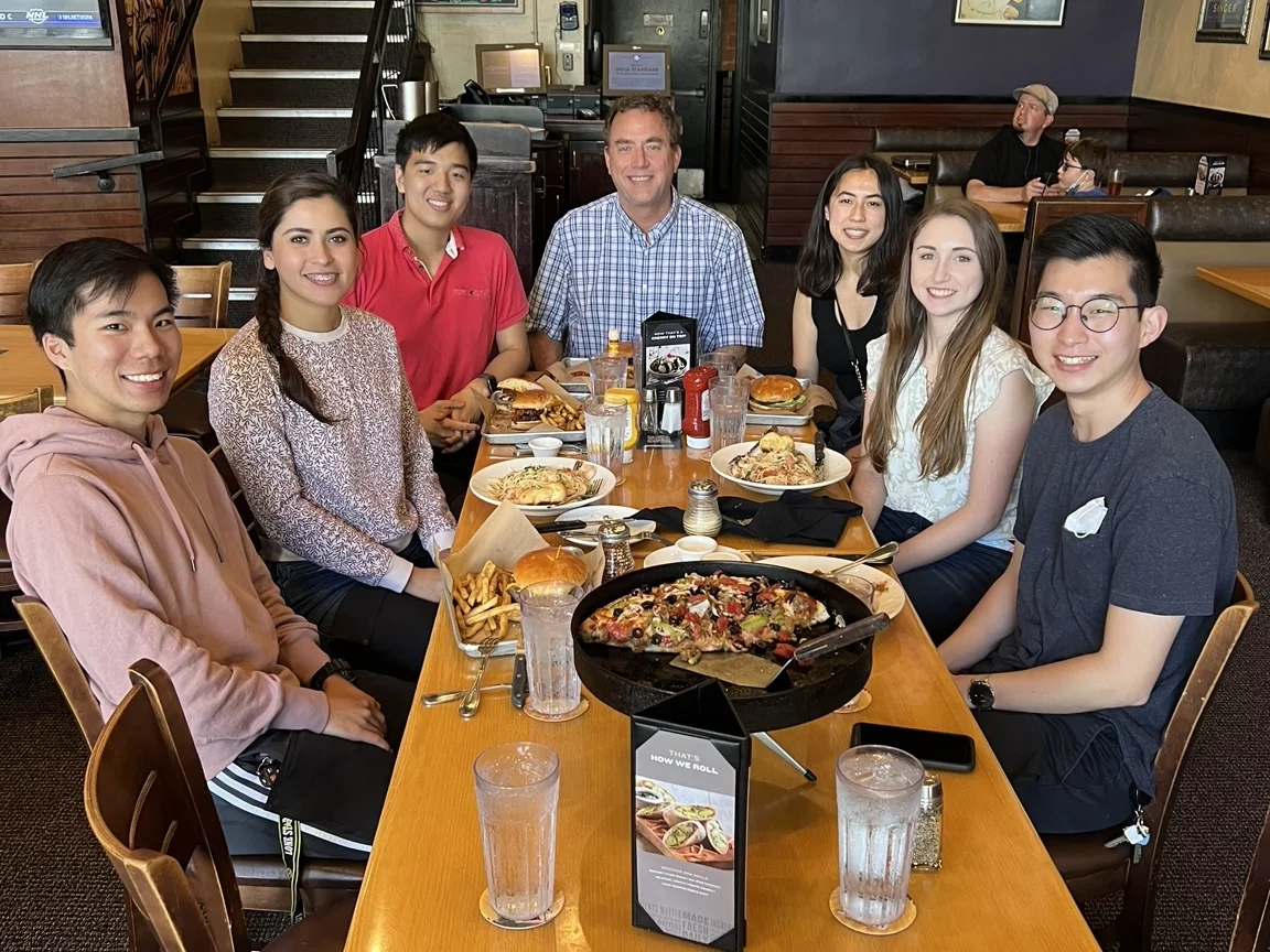The entire lab is posing for a photo during a lunch social at the BJ’s located in Westwood Village.